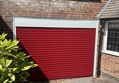 Red Roller Garage Door. Installed in St Bernard’s Road, Sutton Coldfield